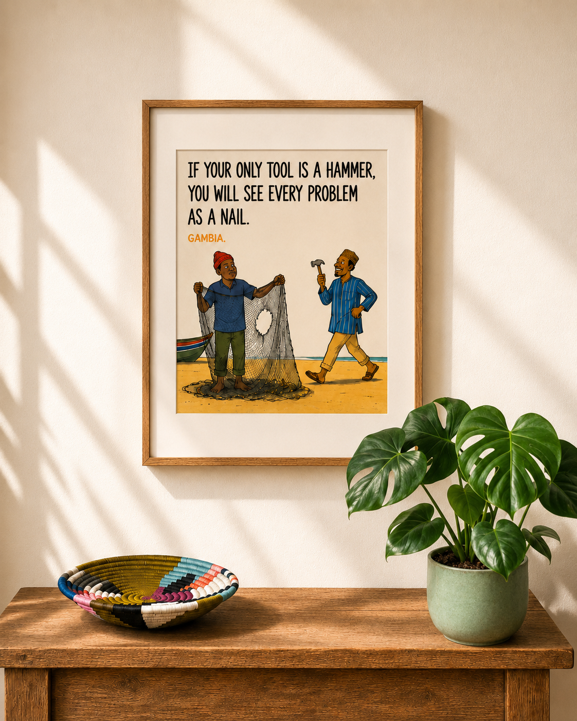 Illustrated art print from The Gambia — a coastal scene with the proverb: If your only tool is a hammer, you will see every problem as a nail. From Mopti's African Proverbs Series.