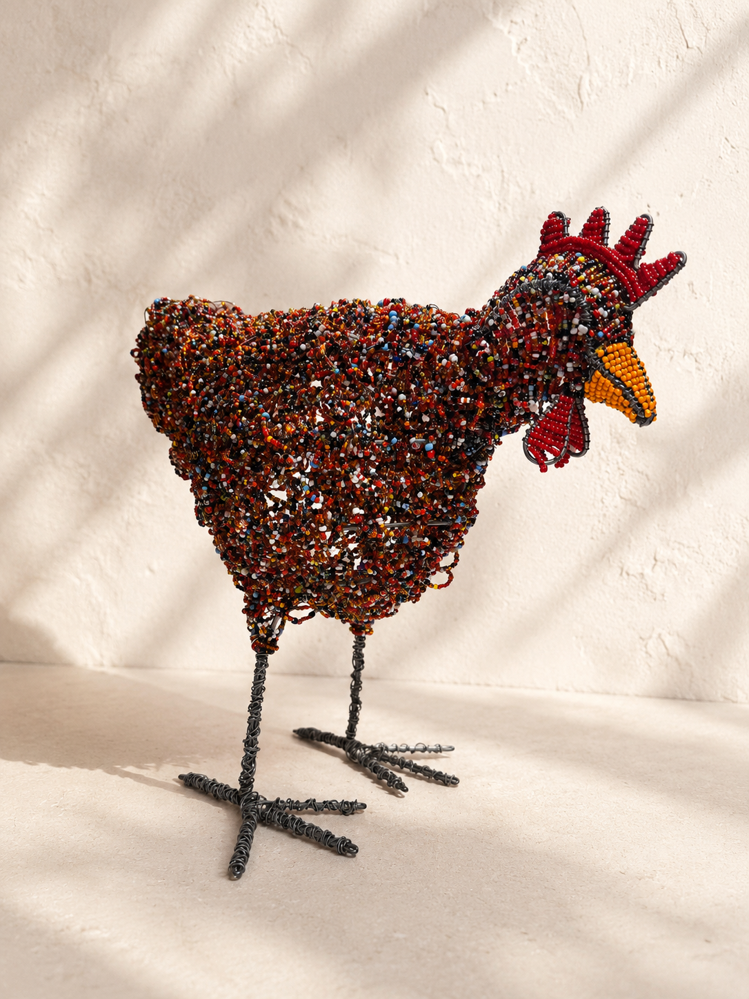 Hand-beaded rooster sculpture densely covered in beads over a twisted wire frame — Mopti Living
