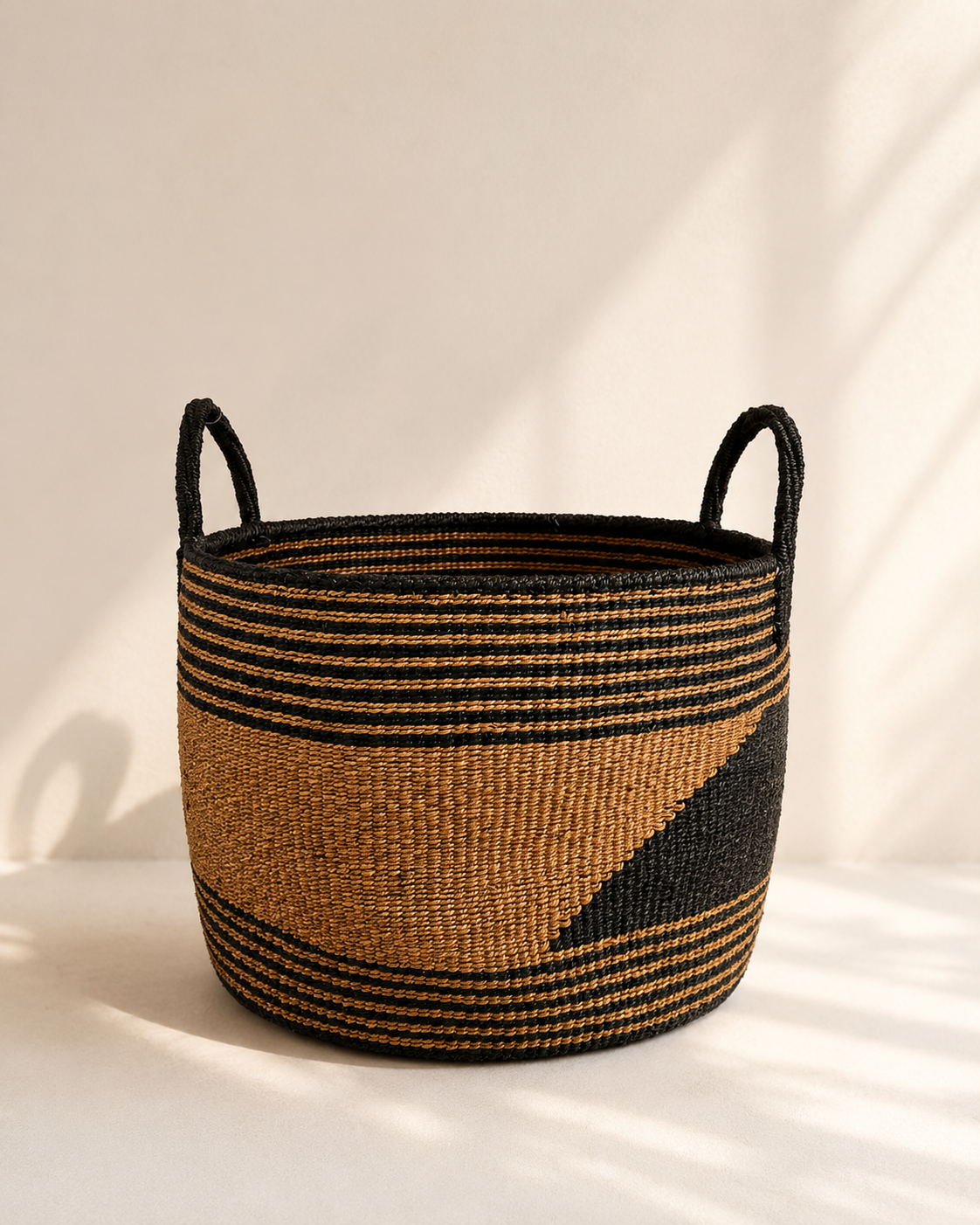 Handwoven storage basket in black and natural weave with handles, mid size — Kitui Storage Basket by Mopti Living