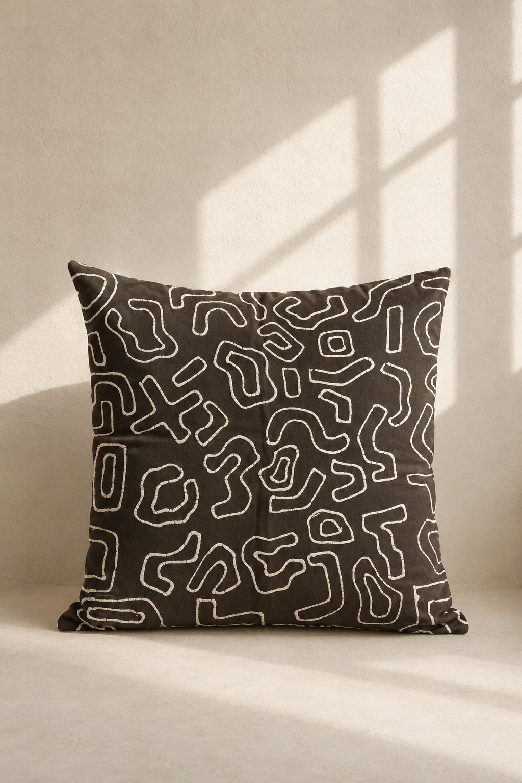 Batiki cushion cover with Kuba outline pattern in dark tones, wax-resist dyed cotton — Mopti Living
