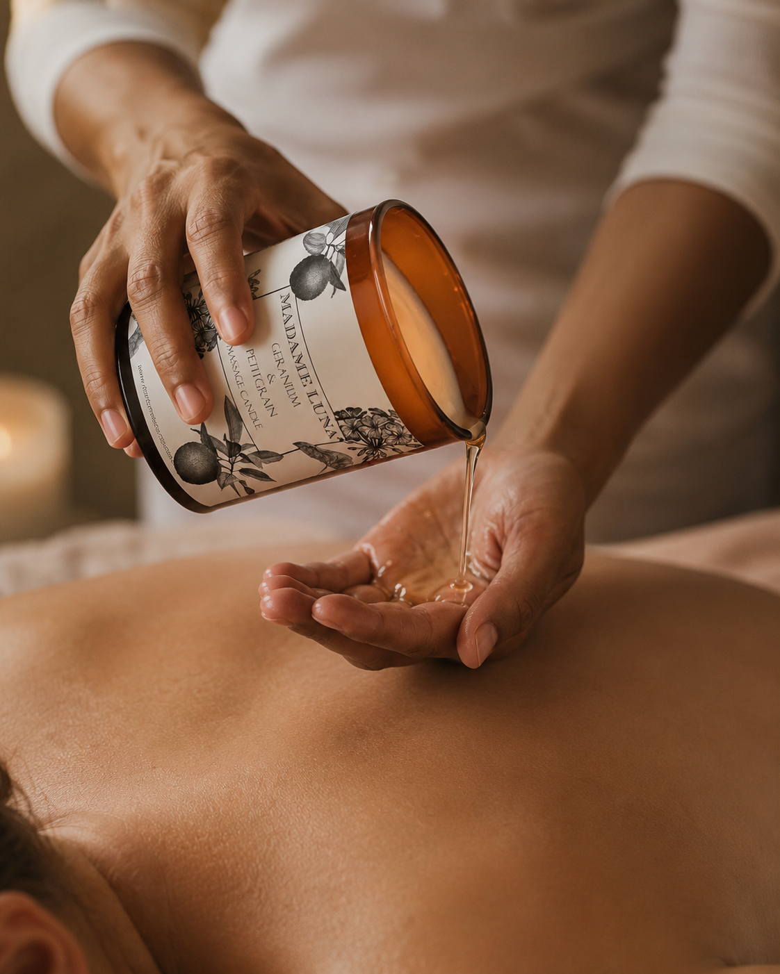 Warm massage oil pooling from a lit Mopti Living massage candle