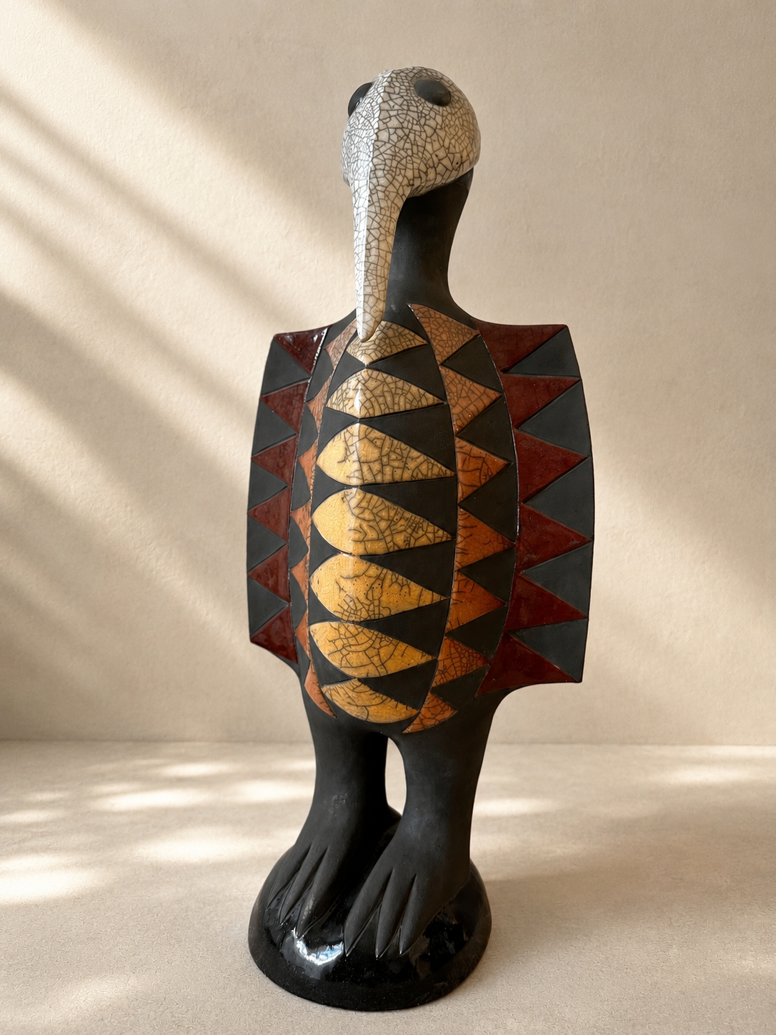 Raku-fired ceramic Senufo bird sculpture with elongated beak and rounded belly, inspired by West African hornbill — Mopti Living