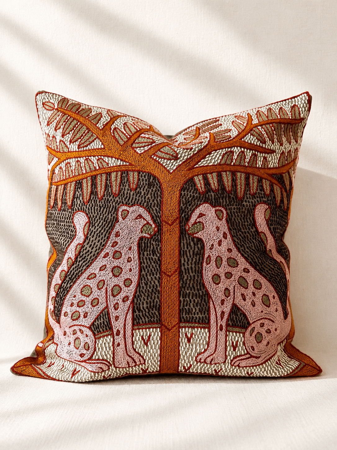 Hand-embroidered cushion cover with two white cheetahs under a tree, acrylic yarn on cotton — Mopti Living
