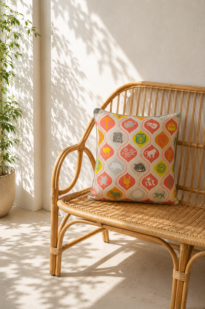 ALS cushion cover in orange with nature-inspired print and contrast piping, 50x50cm — Mopti Living