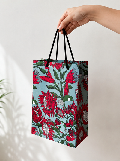 Designer gift bag – Protea on blue illustrated pattern with rope handles by Mopti Living