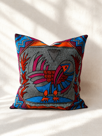 Hand-embroidered cushion cover with blue Senufo bird design, acrylic yarn on cotton — Mopti Living
