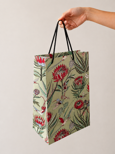 Designer gift bag in Avo green – botanical illustrated pattern with rope handles by Mopti Living