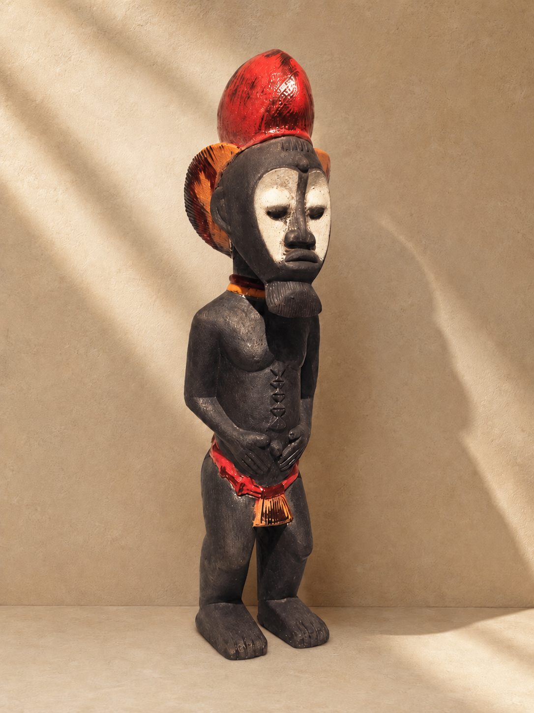 Raku-fired ceramic Baule figure with mask-like face and raised coiffure in red, black and ivory tones — Mopti Living