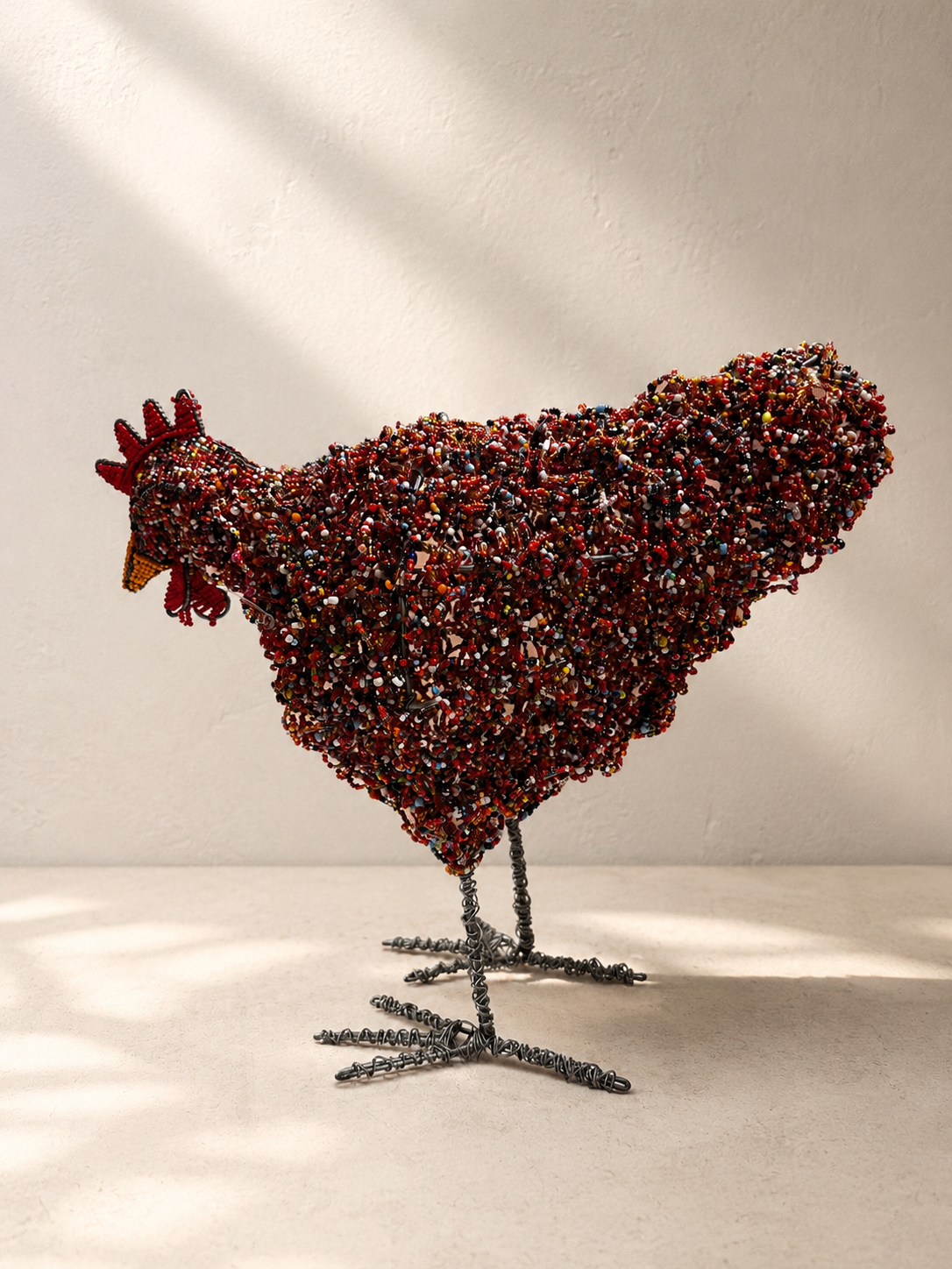 Hand-beaded rooster sculpture densely covered in beads over a twisted wire frame — Mopti Living