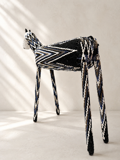 Hand-shaped beaded giraffe sculpture with black, white and blue beadwork pattern — Mopti Living