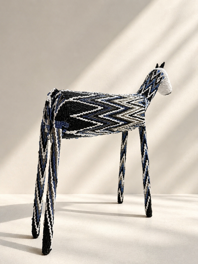 Hand-shaped beaded giraffe sculpture with black, white and blue beadwork pattern — Mopti Living