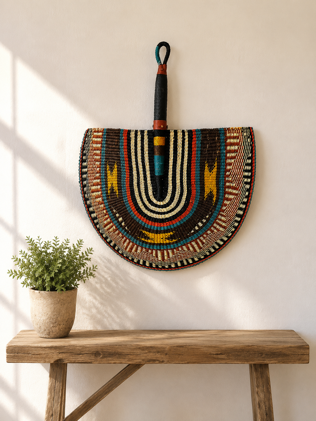 Handwoven Bolga wall fan in black and white — Naba Penga Fan by Mopti Living