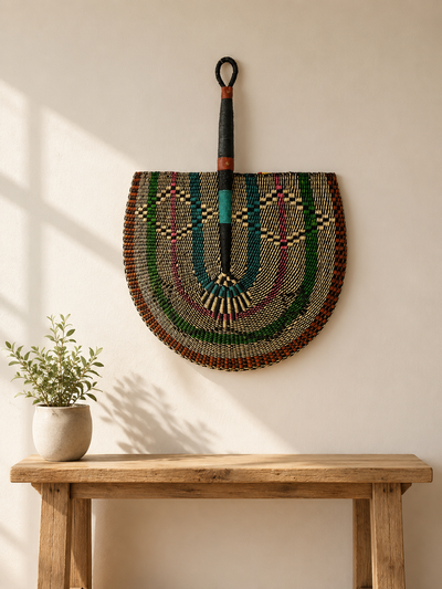 Handwoven Bolga wall fan in brown and black — Naba Penga Fan by Mopti Living