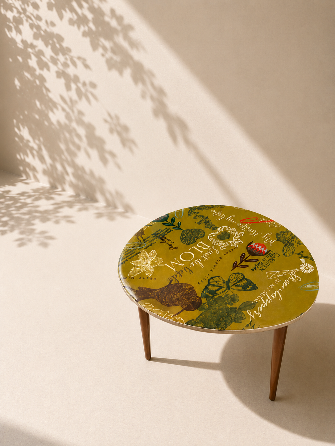 Green retro small resin table. Available at Mopti Living
