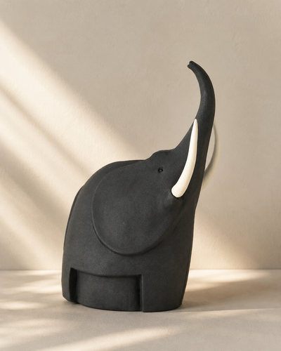 Handmade charcoal stoneware elephant sculpture with white tusks, large — Mopti Living