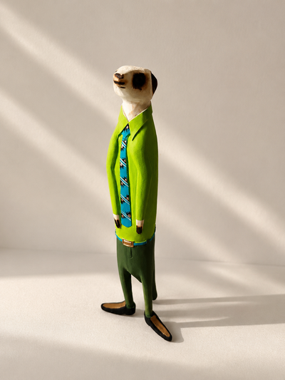 Hand-painted wooden meerkat figurine in green suit — Mopti Living