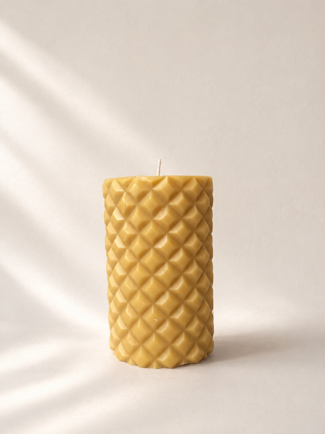 Mayan paraffin candle in ochre. Available at Mopti Living
