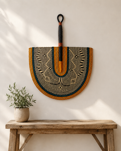 Handwoven Bolga wall fan in orange and green — Naba Penga Fan by Mopti Living