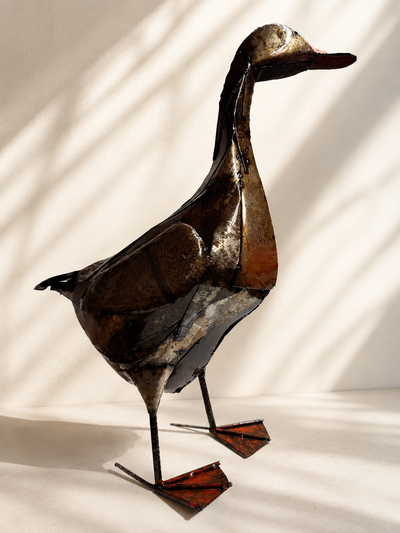 Handmade recycled metal duck sculpture with layered patina and textured finish — Mopti Living

