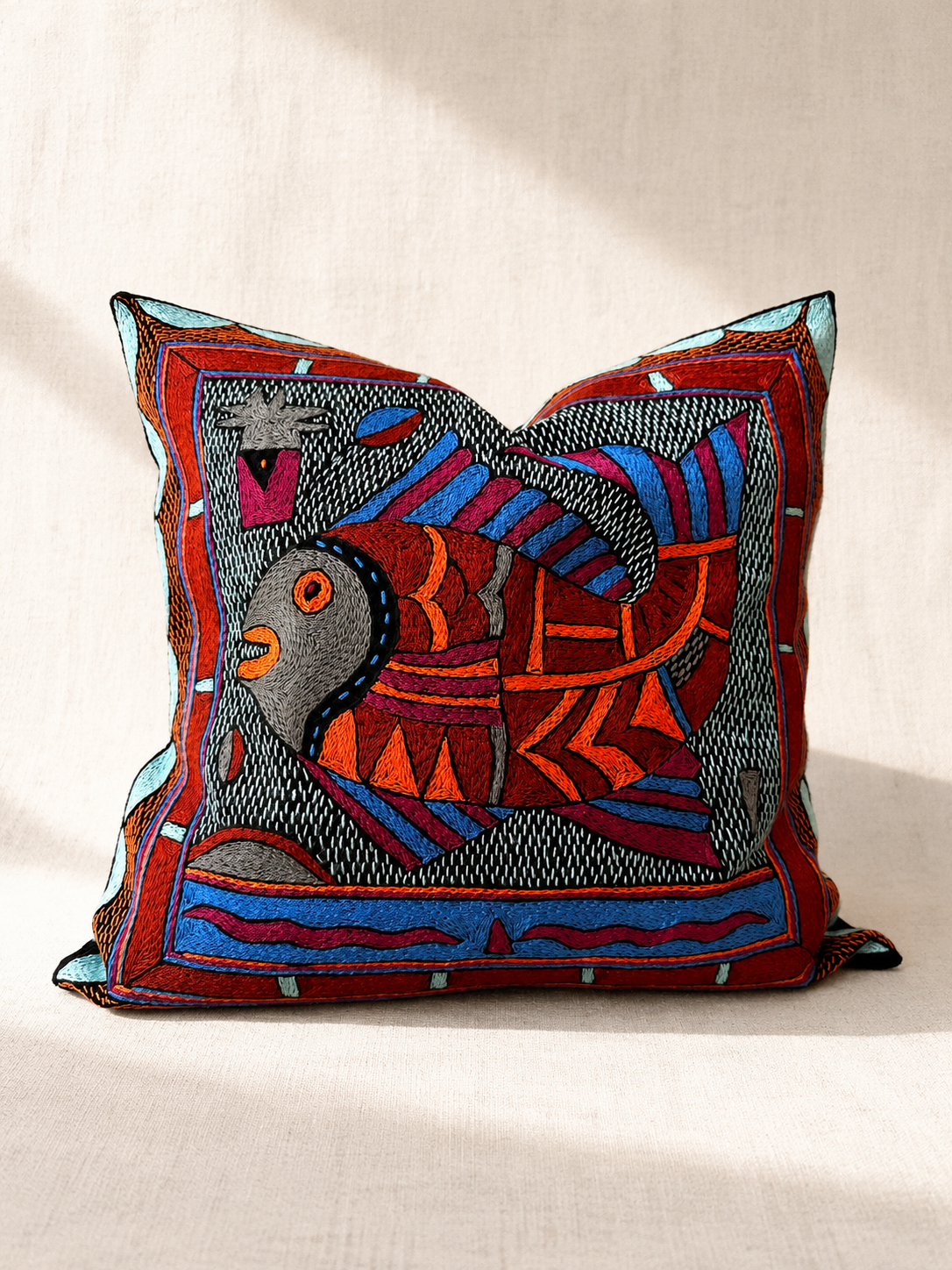 Hand-embroidered cushion cover with red fish design on beige, acrylic yarn on cotton — Mopti Living