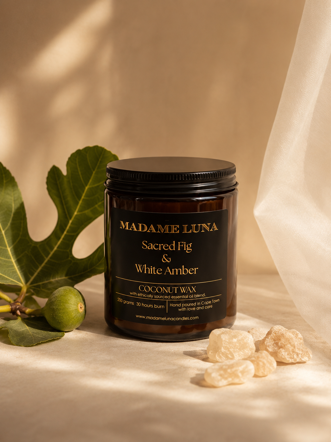 Mopti Living sacred fig and white amber coconut wax candle in a dark amber glass jar