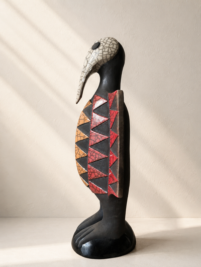 Raku-fired ceramic Senufo bird sculpture with elongated beak and rounded belly, inspired by West African hornbill — Mopti Living