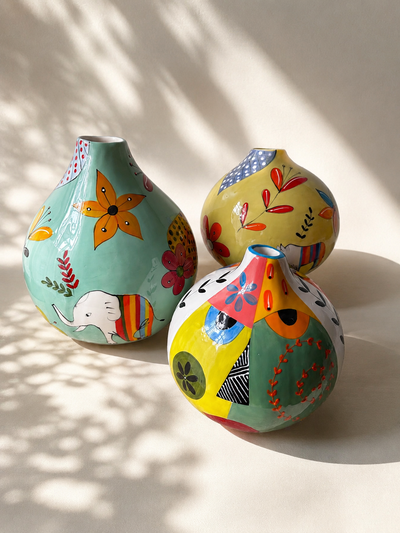 A collection of hand painted ceramic calabashes. Perfect for gifting. Shop at Mopti Living