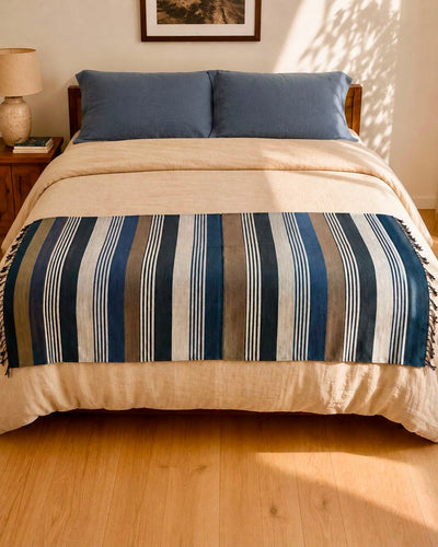 Sitota handwoven Ethiopian cotton throw draped at the foot of a bed – Mopti Living
