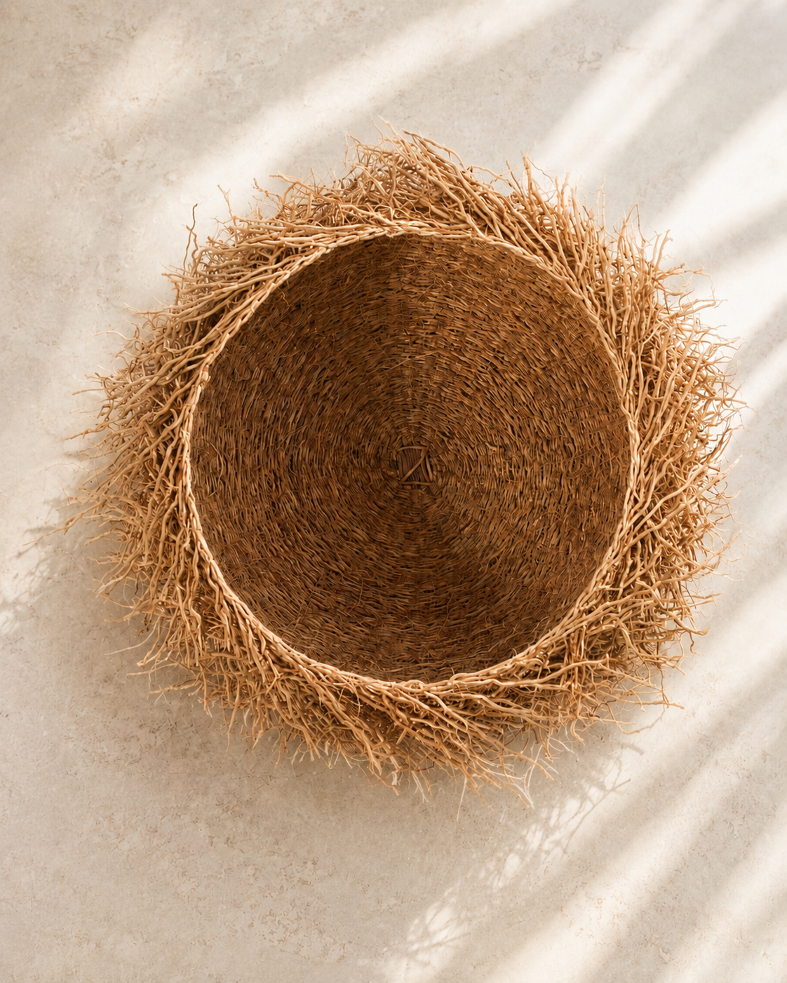 Handwoven vetiver root basket bowl, medium, with natural loose root edge — Vetiver Nest Basket by Mopti Living
