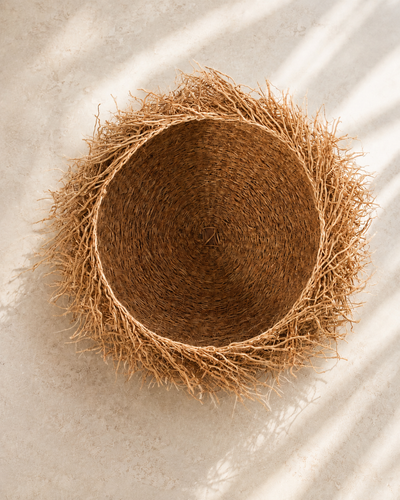 Handwoven vetiver root basket bowl, medium, with natural loose root edge — Vetiver Nest Basket by Mopti Living