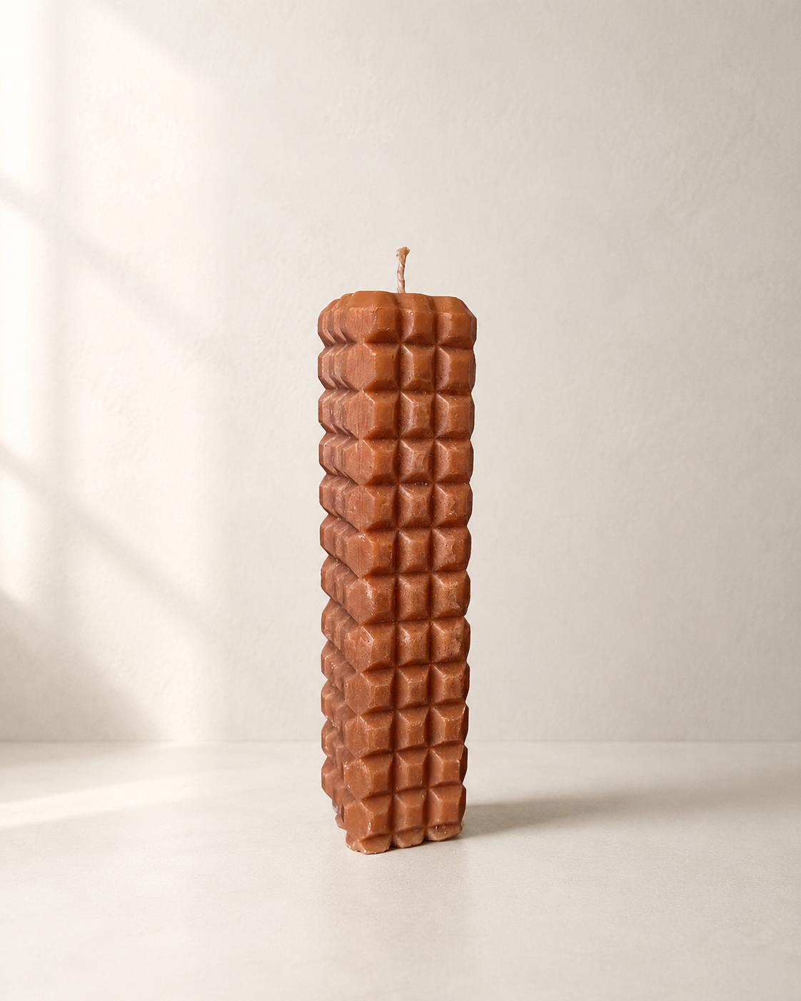 Wabi sculptural pillar candle in Apricot – raised geometric texture, handmade finish | Mopti Living
